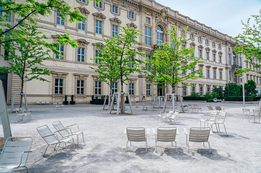 Berlin, Germany - May 22, 2023: chairs in front of Humboldt Forum museum complex in Berlin, Germany