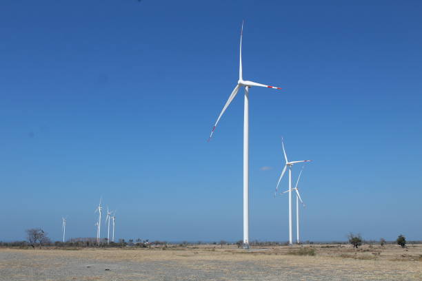 istock windmills in the middle of a meadow with a blue sky 1516019376