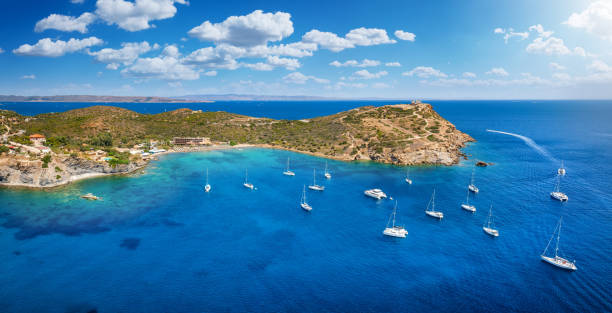 The bay of Cape Sounion in Attica, Greece, with Poseidon Temple and beach The bay of Cape Sounion in Attica, Greece, with Poseidon Temple and beach, gate to the Cyclades islands for sailors and tourists headland stock pictures, royalty-free photos & images