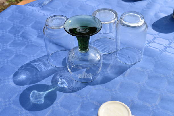 Glases on an outdoor table - upside down.