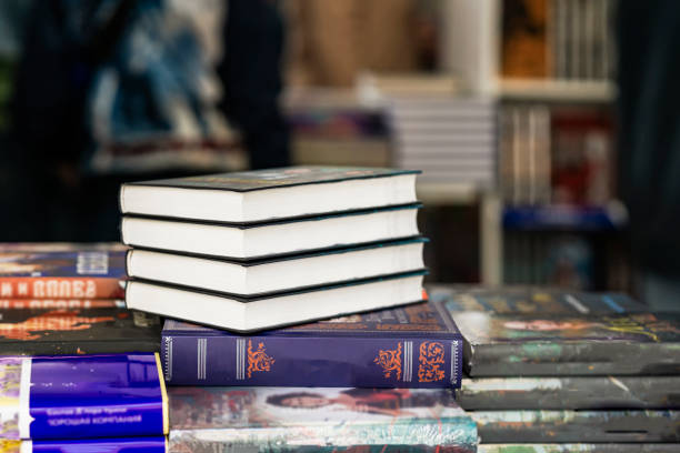 istock Closeup of books on table in book store. Education, school, study, reading 1516065232