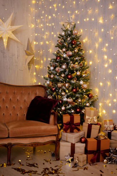istock Christmas interior - decorated living room with Christmas tree, gift boxes and lights 1516084971