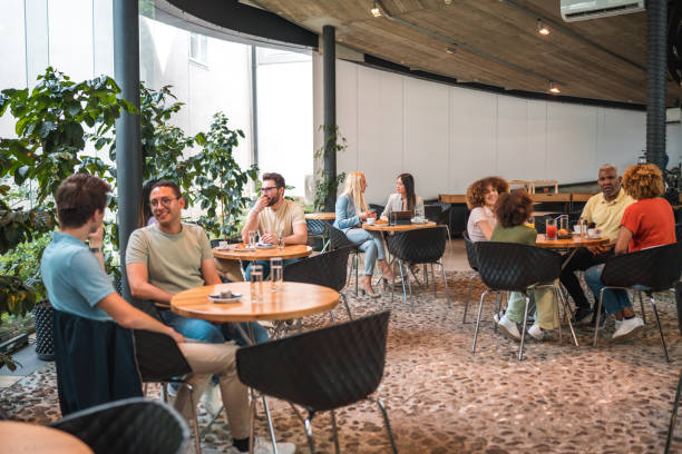 istock Diverse Group Engaging in Coffee Delights at Modern Cafeteria 1516104764