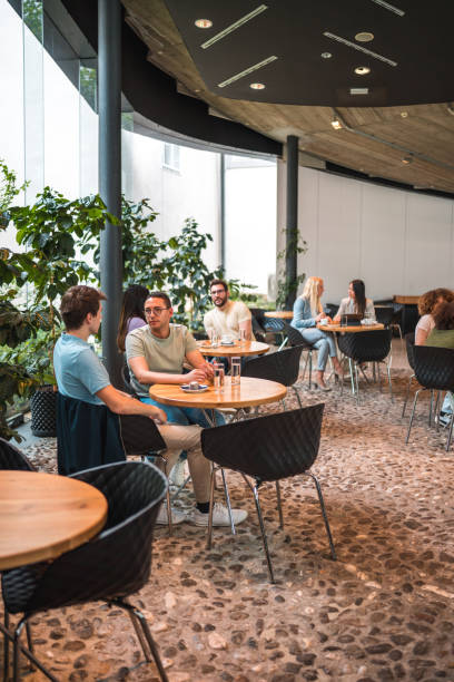 istock Diverse People Unwinding and Sipping in a Modern Cafeteria 1516105286