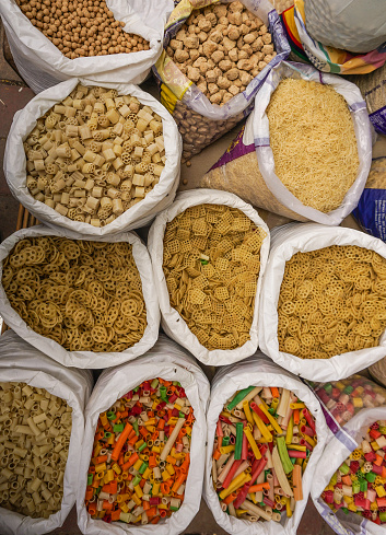 Selling nuts at street market in Delhi, India. Delhi city proper population was over 11 million, the second-highest in India.