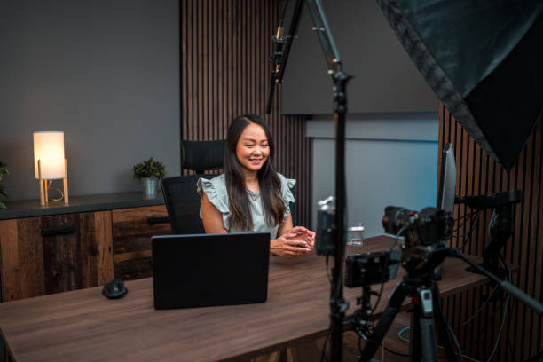 istock Focused Asian Female Content Creator Recording 1516112521