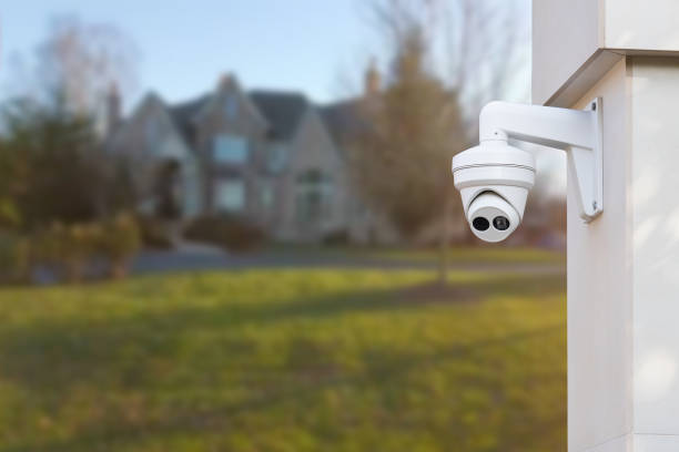istock CCTV Camera with house in background. Close-up. 1516114178