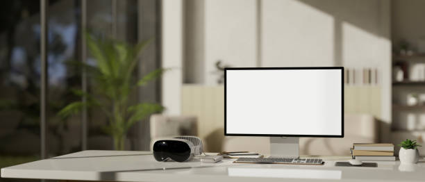 istock A modern office desk workspace with computer mockup, a modern VR goggles, and accessories. 1516114786