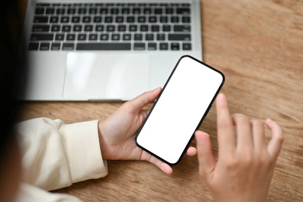 istock Top view image of a female using her smartphone while remote working at a coffee shop. 1516117020