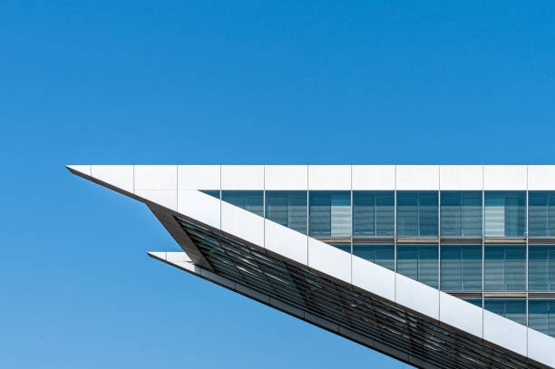 Low angle view of modern office building against clear sky, Hamburg Altona