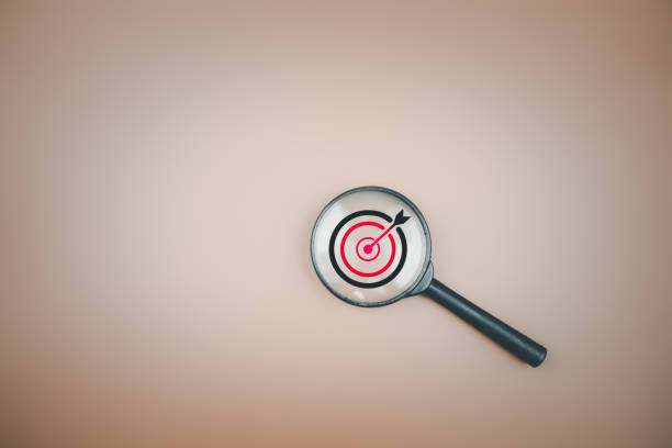 istock Target board inside magnifier glass for focus business objective with copy space. 1516127914