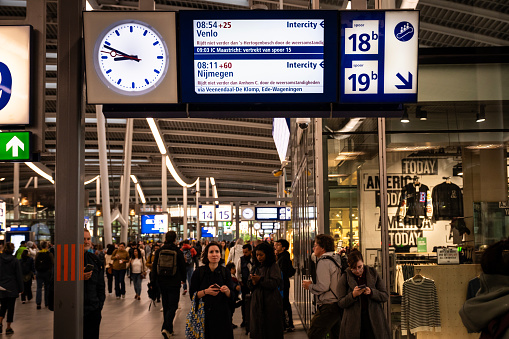 Shot of a sign showing the train schedule in a German terminal