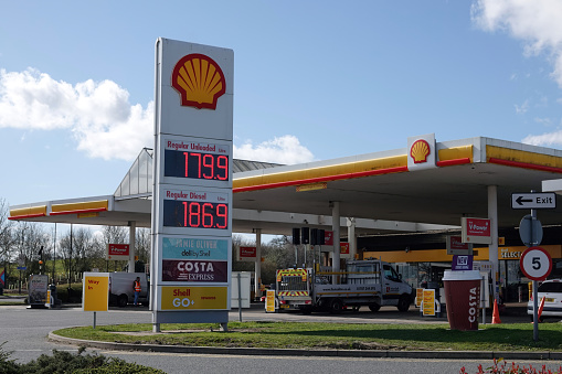 Peterborough, UK - March 14, 2022: High fuel prices on an electronic signboard at a Shell petrol station in the UK.
