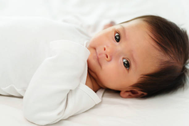 istock newborn baby lying on a bed 1516215848