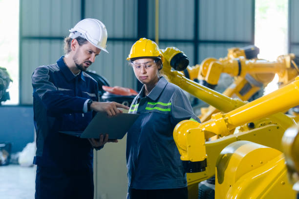 istock Engineers working robot assembly industry plant in factory using laptop examining condition inspection quality robotic arm. teamwork technician robotic industrial. 1516249408