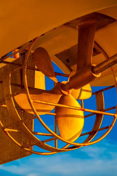 Closeup of a boat propeller at sunset.