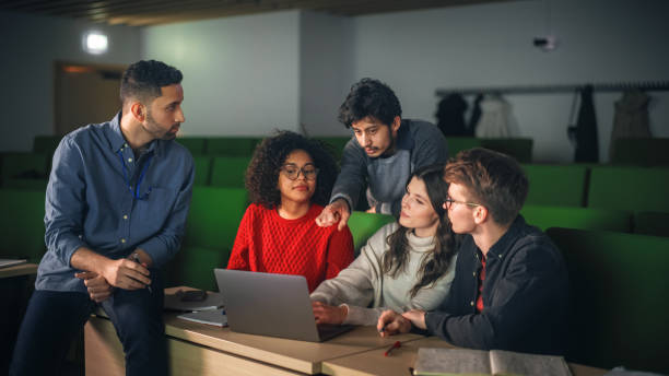 istock Group of Multiethnic Enthusiastic Students Comparing Research Findings in University Study Room. Young Doctorate Researcher Joining the Conversation with Colleagues 1516267900