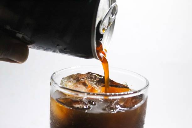 istock pouring cola from a can into a glass 1516272841