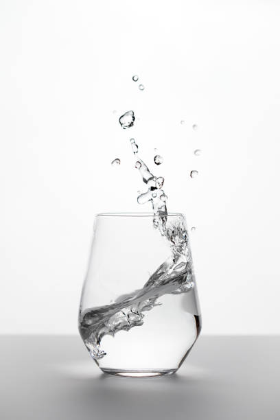 istock Glass with water with splash 1516295684