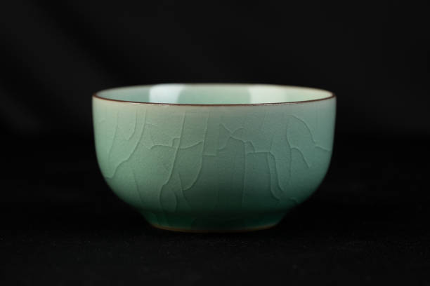 Longquan celadon from China, Chinese high-end tea set, celadon tea set with crack decoration, indoor dark background