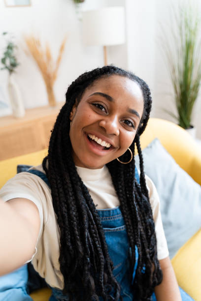 istock Smiling woman taking selfie from home. 1516325470