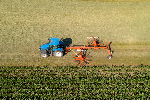 istock Tractor in field, aerial view 1516337275