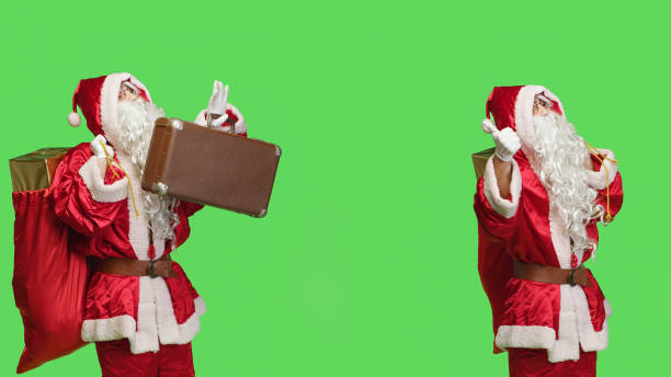 istock Santa hitchhiking with suitcase and sack 1516361088
