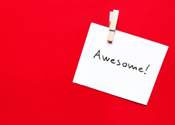 istock White note on copy space red background with handwritten text AWESOME! praise to someone to tell them they are doing good or great job or well done or do something excellent 1516406138