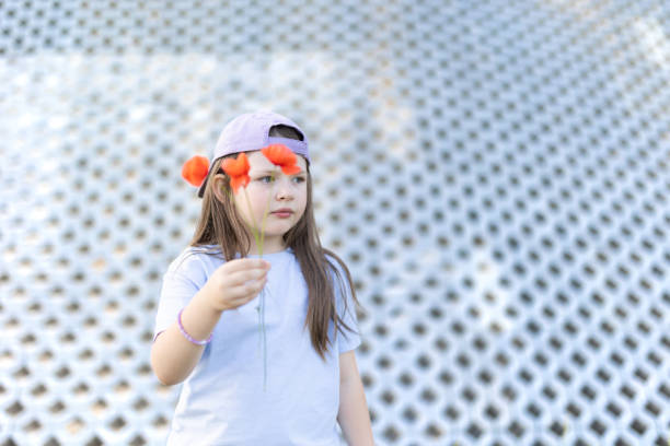 istock Young Girl with Poppies 1516439862