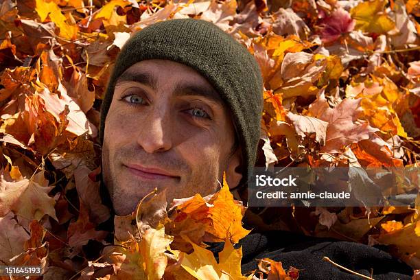 Young Man Playing With Leaves Stock Photo - Download Image Now - Activity, Adult, Autumn