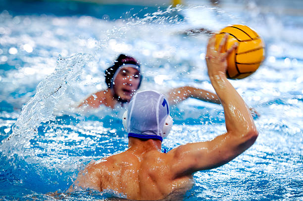 water polo players two water polo players during a game deltoid photos stock pictures, royalty-free photos & images