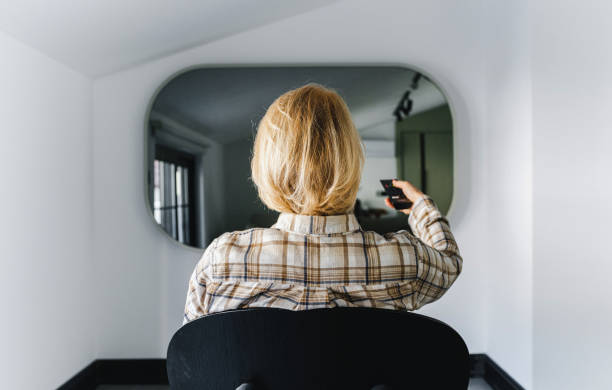 istock Turning on mirror TV in living room 1516455197