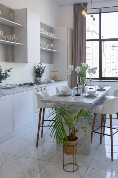 istock close view kitchen with dinning marble table and hight bar stools in minimalistic light elegant luxury design of a modern spacious studio apartment in soft pastel beige colors 1516463393