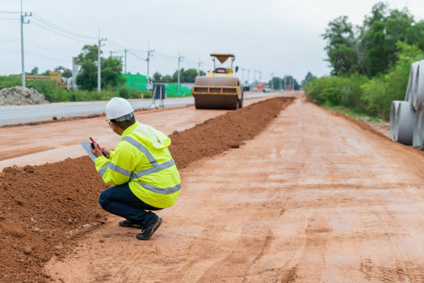 istock An Asian engineer inspects a road roller on site using a walkie-talkie. 1516479266