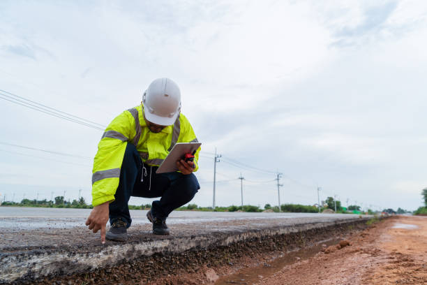asian civil engineers inspect roads before construction. - azimuth imagens e fotografias de stock
