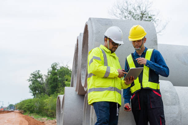istock Asian engineer and contractor planning at construction site by finding information via tablet 1516481701