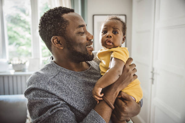 istock Father holding his baby 1516482944