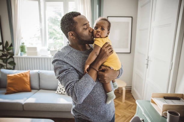 istock Father holding his baby 1516483463