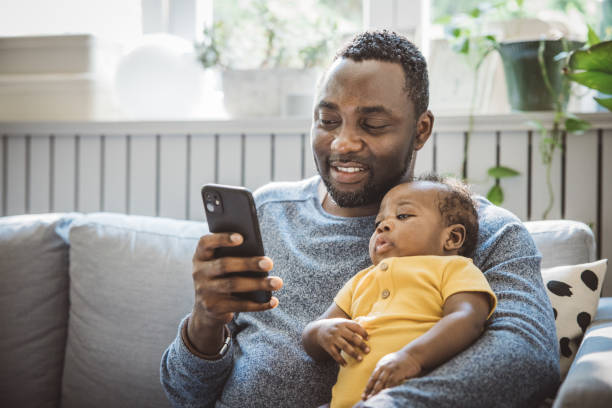 istock Father and baby at home 1516484501