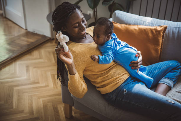 istock Joyful Mother Playing with Baby 1516486674