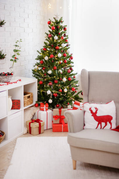 istock living room with armchair and christmas tree 1516517082