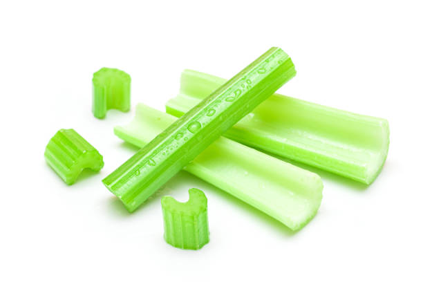 istock Fresh Chopped Celery Sticks and Slices with Water Drops Isolated on White Background 1516525806
