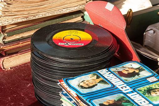 Ankara, Turkey - April 6, 2014: Ayrancı Antique Bazaar, which opens in the Ayrancı district on the first Sunday of every month in Ankara. Records and books stacked on top of each other