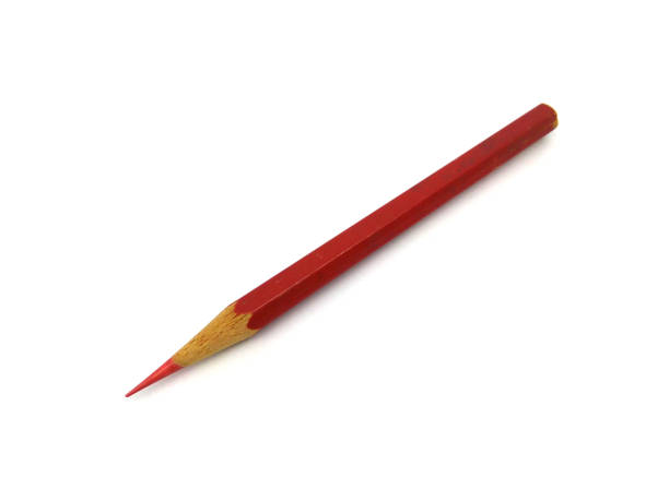 istock Red colored pencil isolated on white background. 1516557254