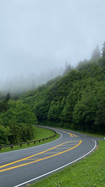 istock Road in the mountains and fog. 1516578874