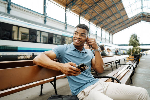 istock Millennial African American entrepreneur going to work and using smart phone, man has earphones and listening to music 1516582210