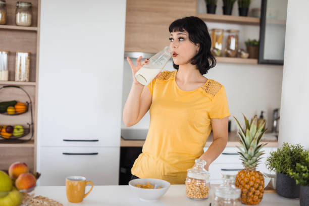 istock Girl drinking milk 1516583800