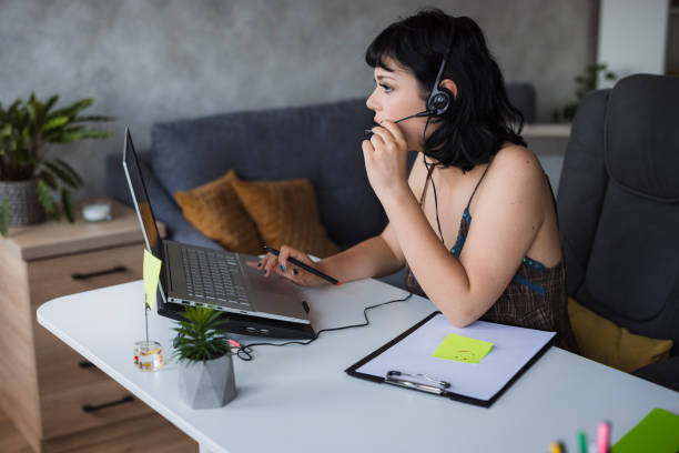 istock Serious girl speaking via headset 1516590104