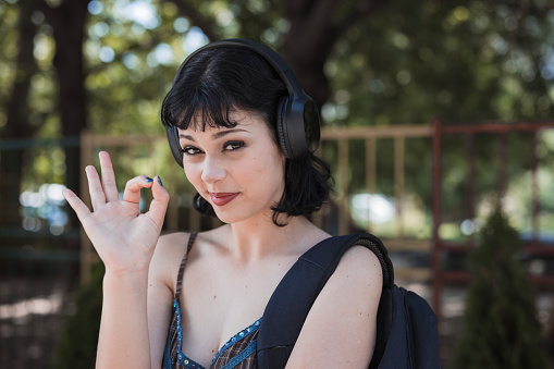Girl listening music and gesturing