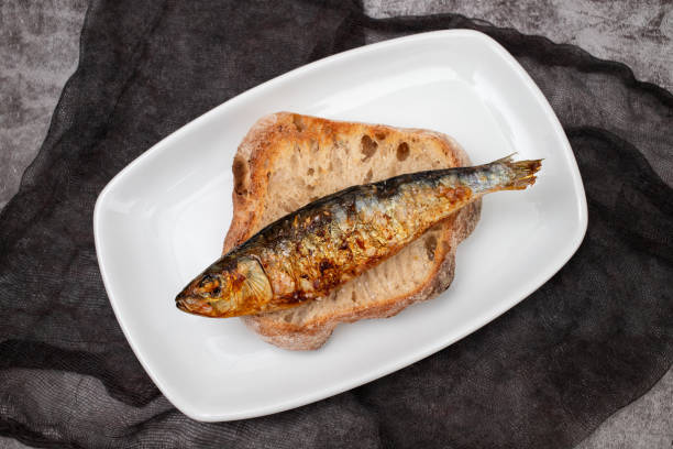 istock Grilled sardines with sauce on fresh bread 1516606598